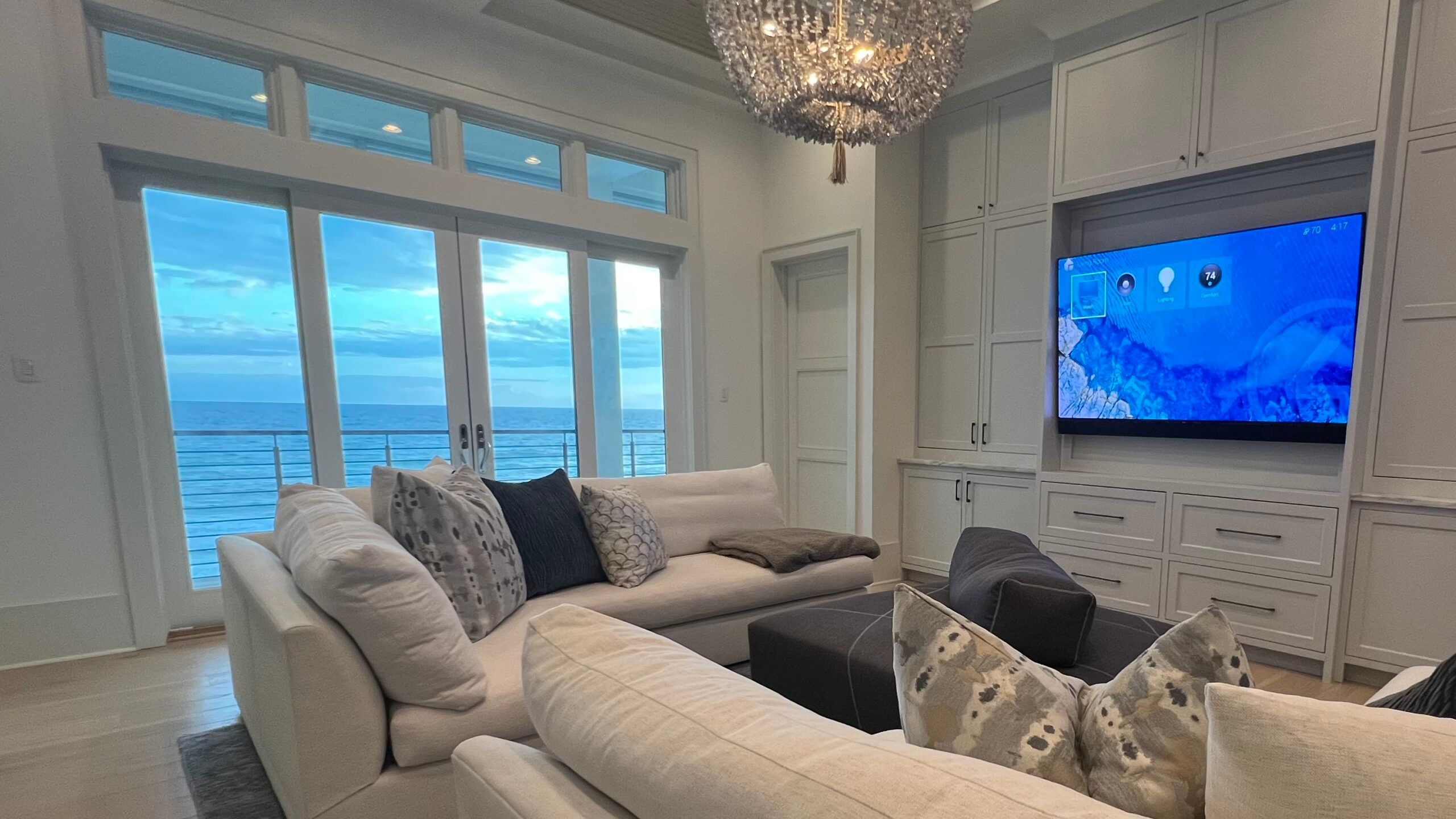 Waterfront living room with a wall-mounted TV